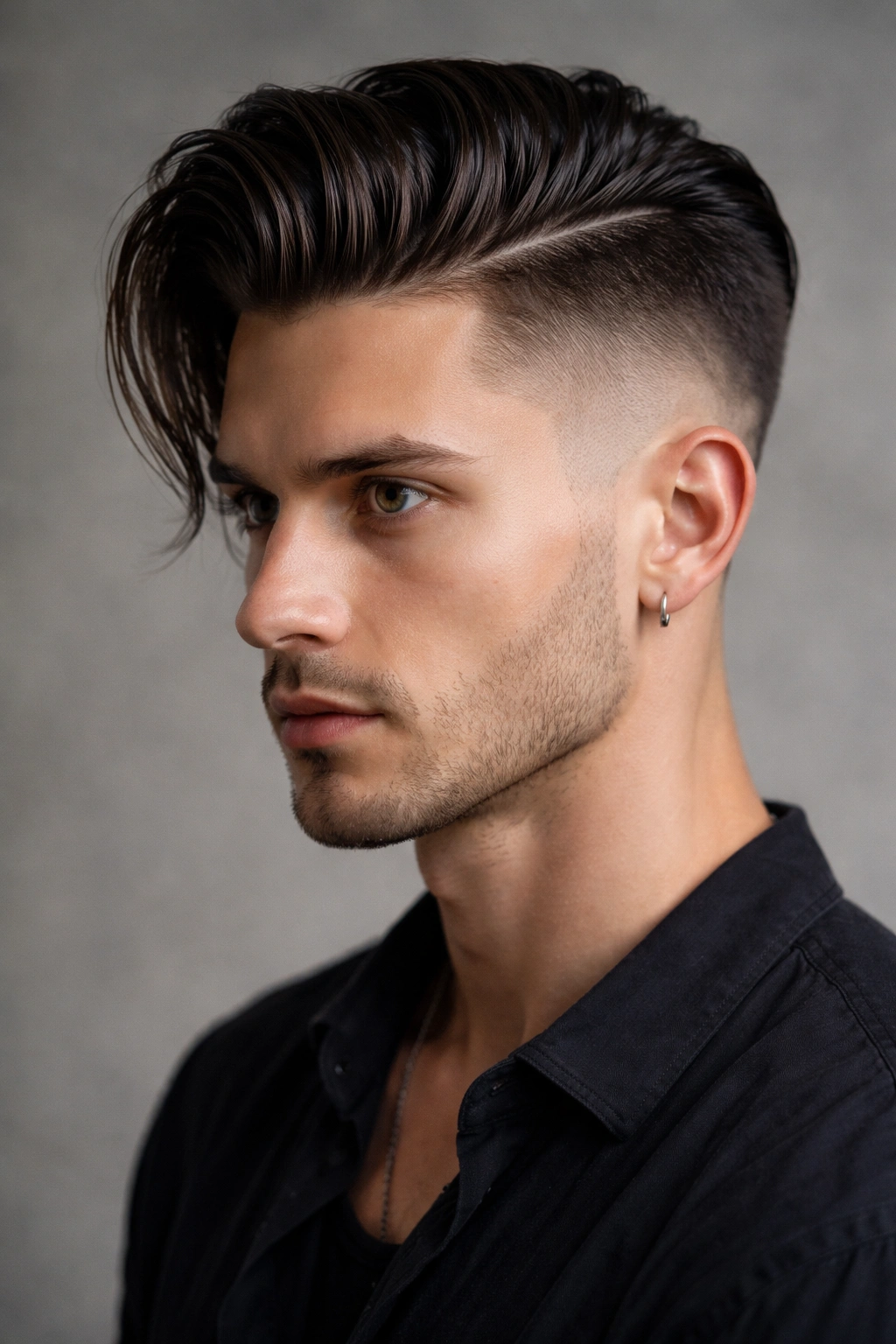 12 Asymmetrical Haircuts With A Modern Edge 7 Close-up portrait of a hairstyle with a dramatic asymmetrical fade and slicked-back longer side