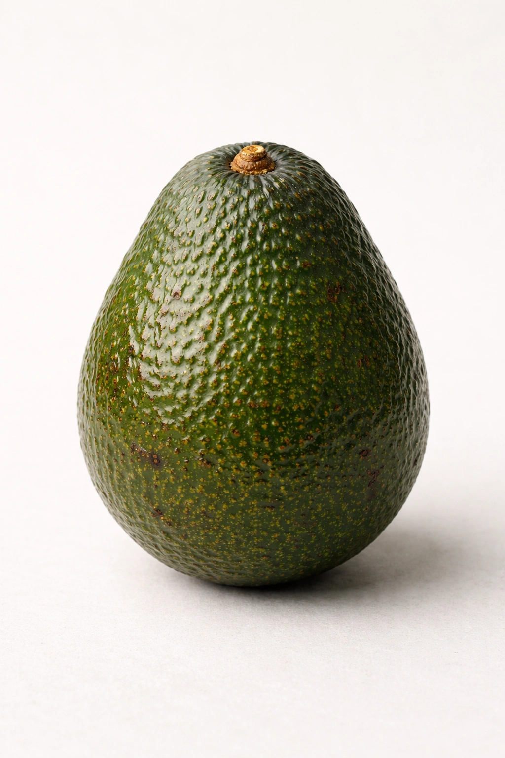 Ripe avocado with minor blemishes indicating caution for use