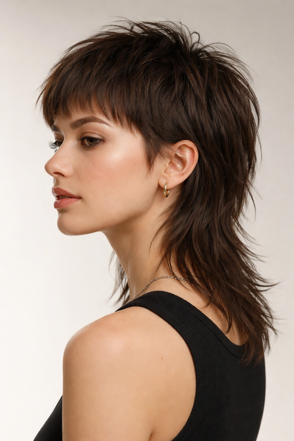 Model showcasing a baby mullet with a short front and long back
