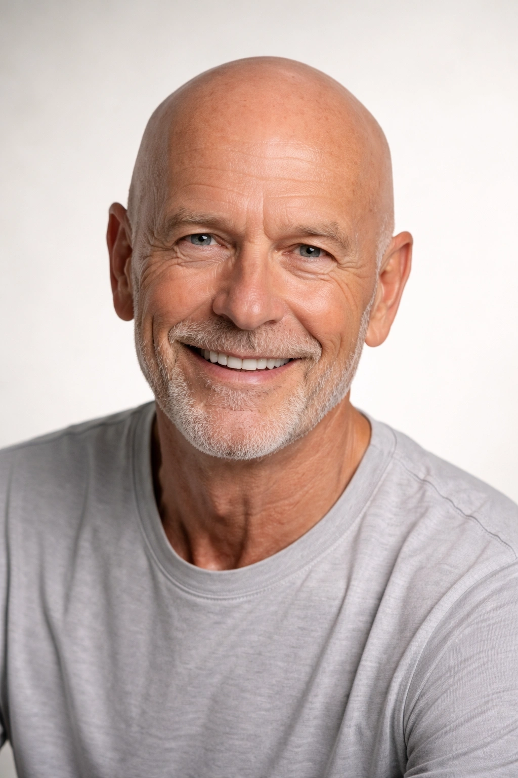 Portrait of a bald older man with a smooth shaved head