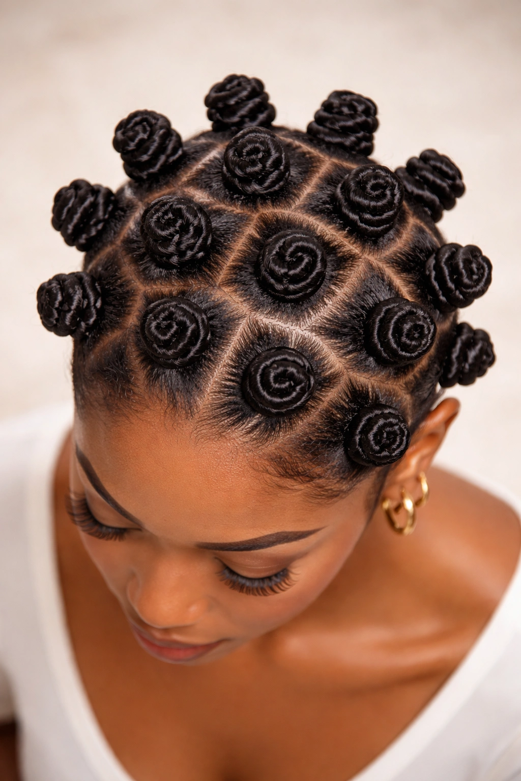 Top-down view of a head with neatly arranged bantu knots across the scalp