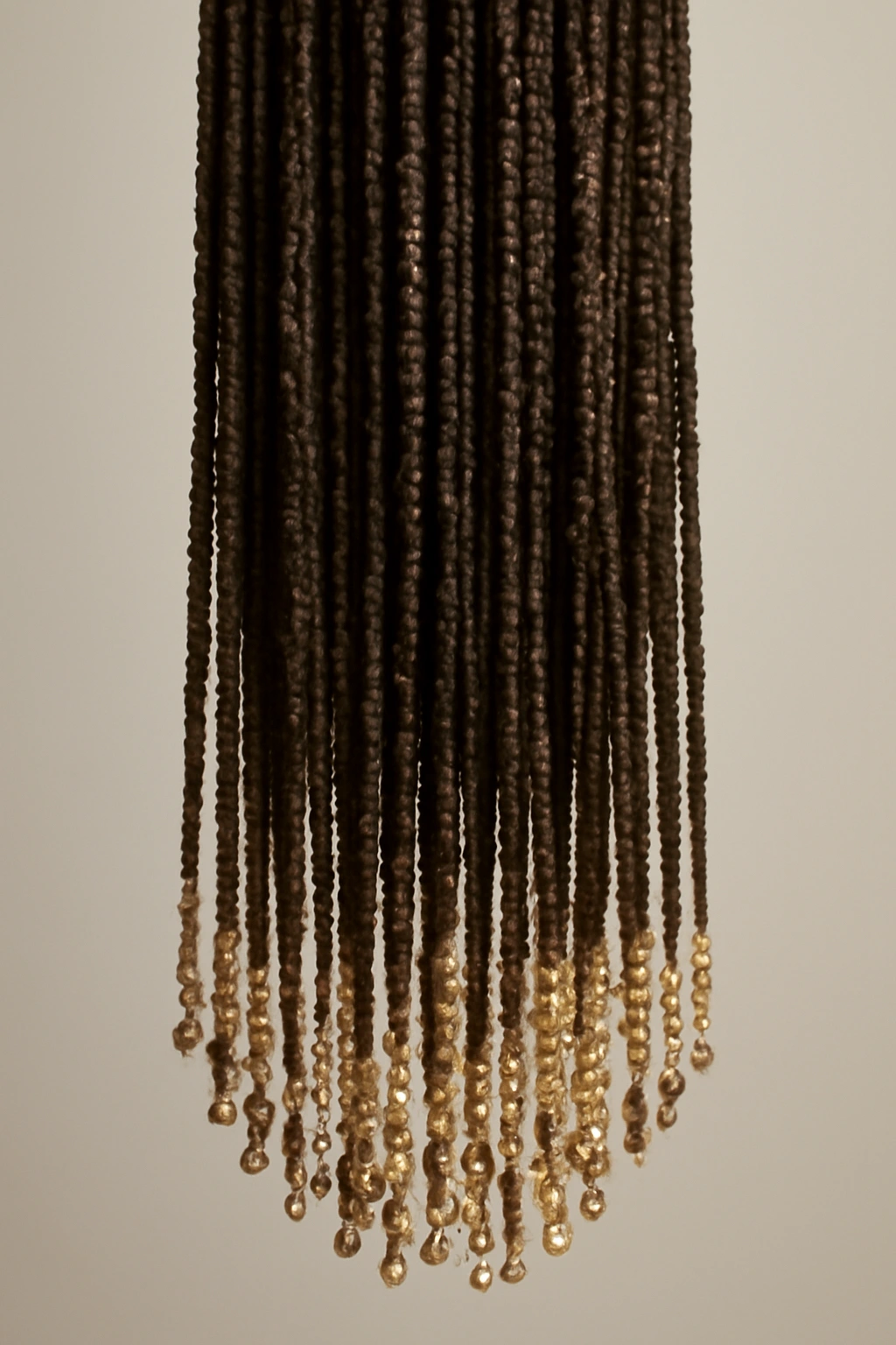 Long braids with beaded extensions at the ends