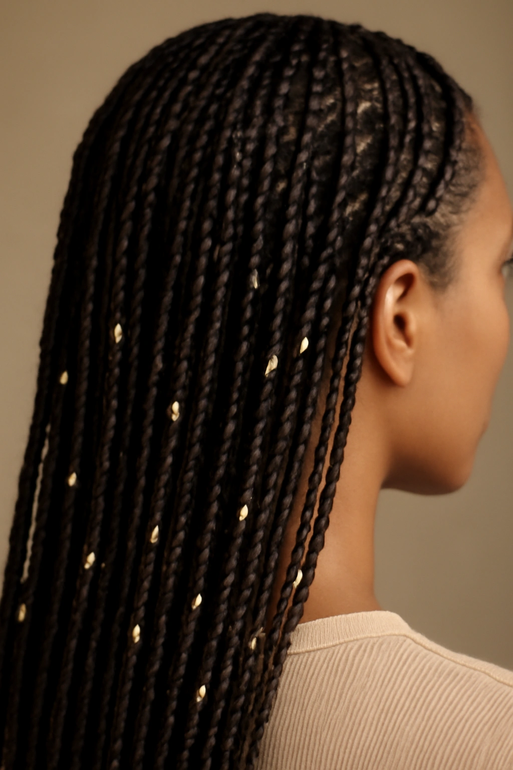 Micro braids adorned with beads catching light along their lengths