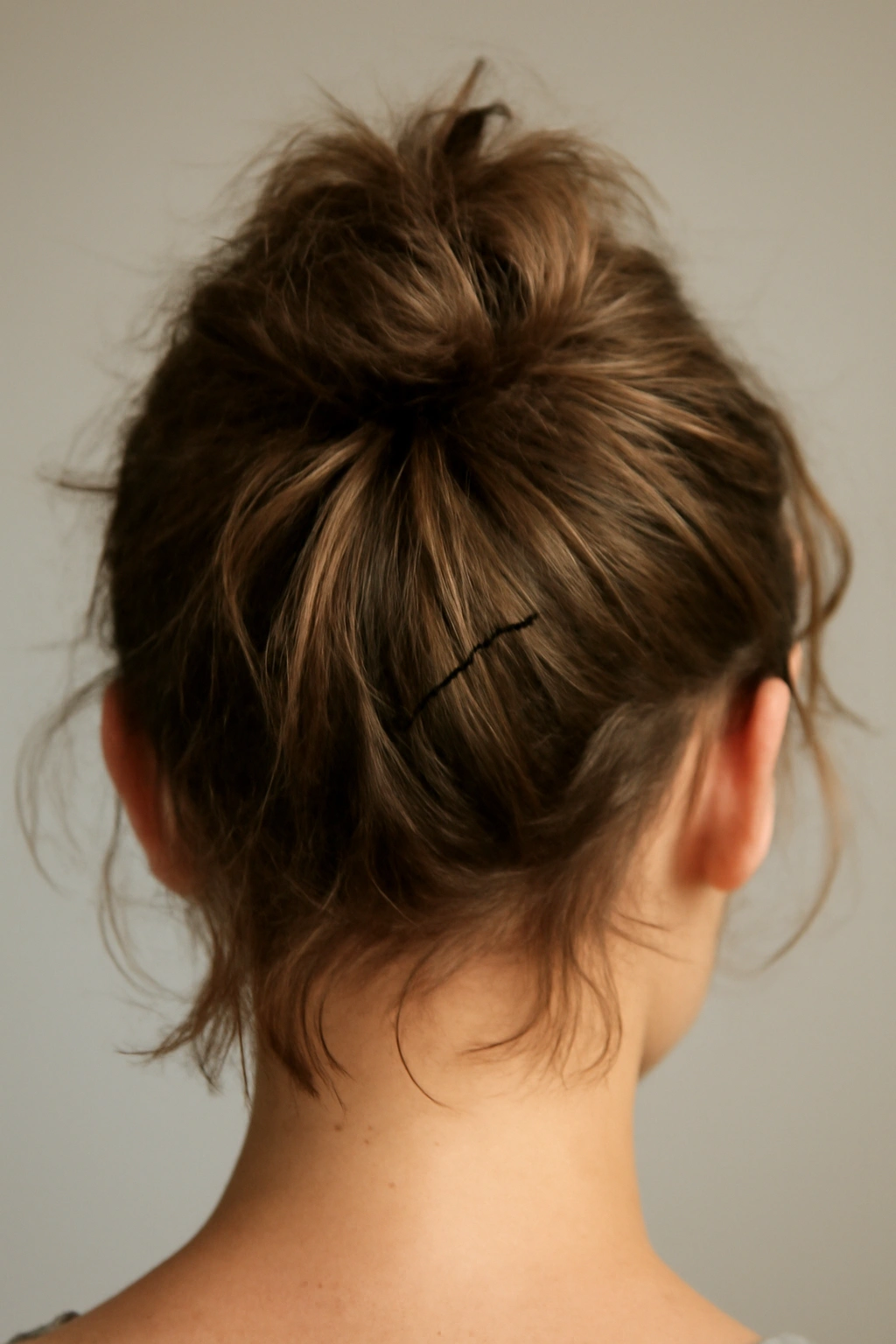 8 Messy Bun Ideas for Short Hair That Actually Stay 11 Short-haired bun slipping out due to insufficient grip and texture