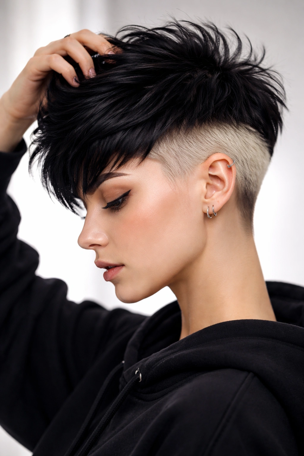 10 Edgy Pixie Cuts With Serious Attitude 8 Pixie hairstyle with dark top and bright undercut color visible