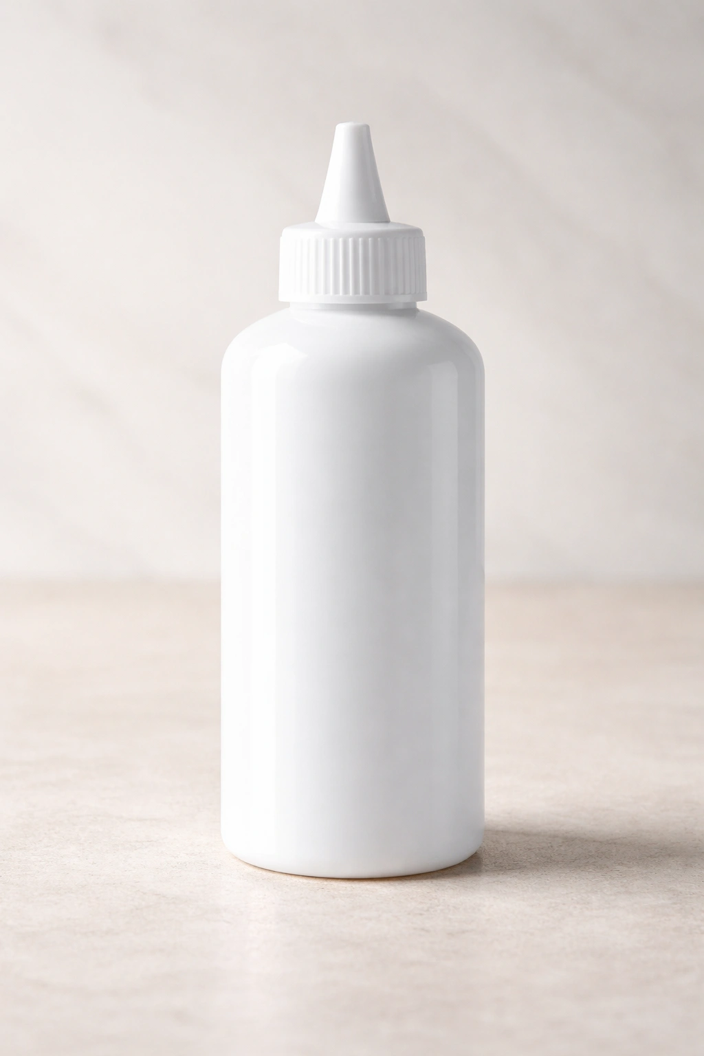 Plain white bottle of color remover on neutral background