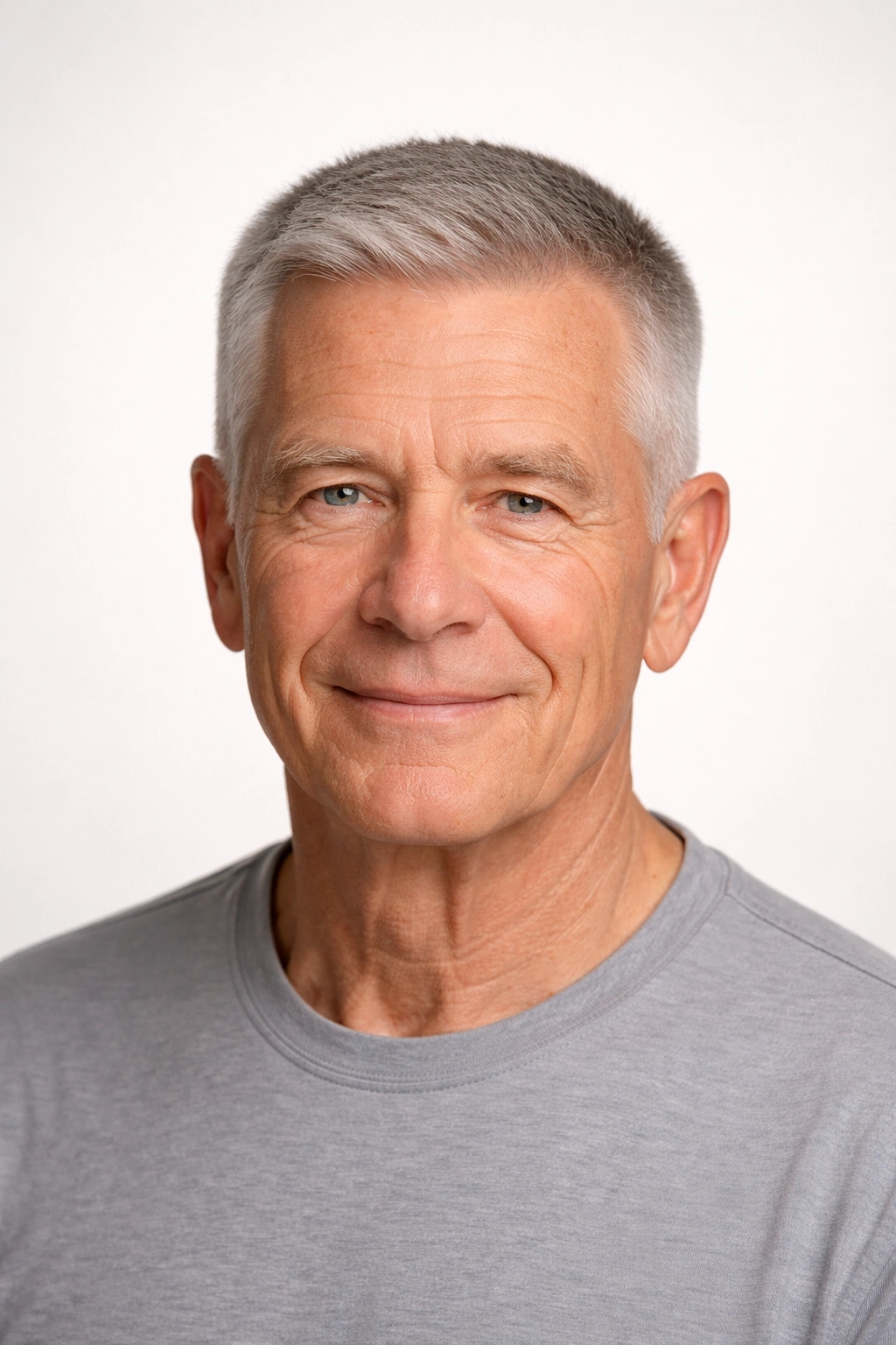 Older man with a classic crew cut, short sides, longer top.