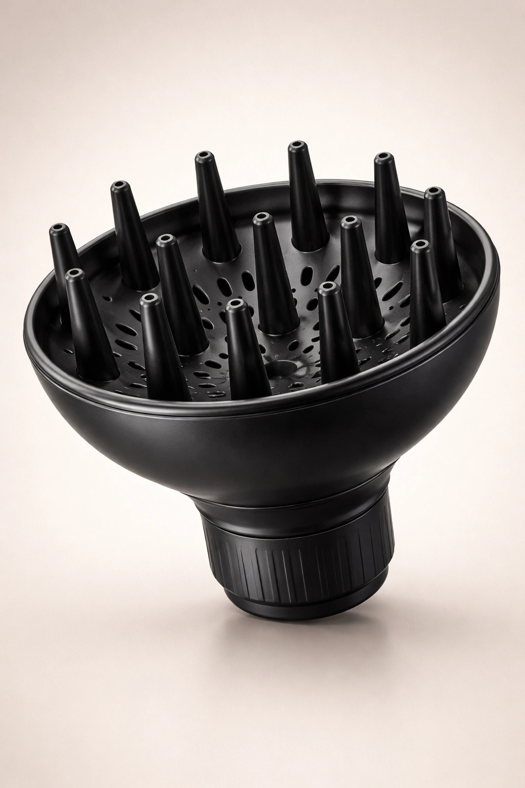 Close-up of a cup-style diffuser with long prongs and deep bowl