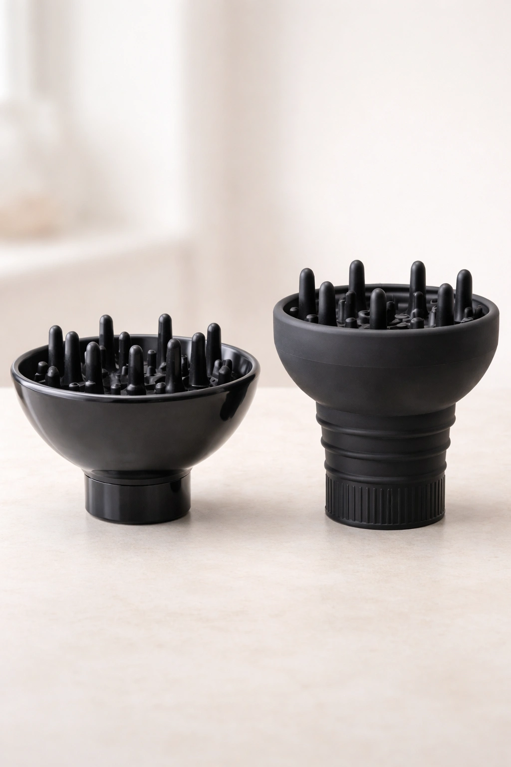 Pair of diffusers showing cup/bowl and silicone sock styles on neutral background