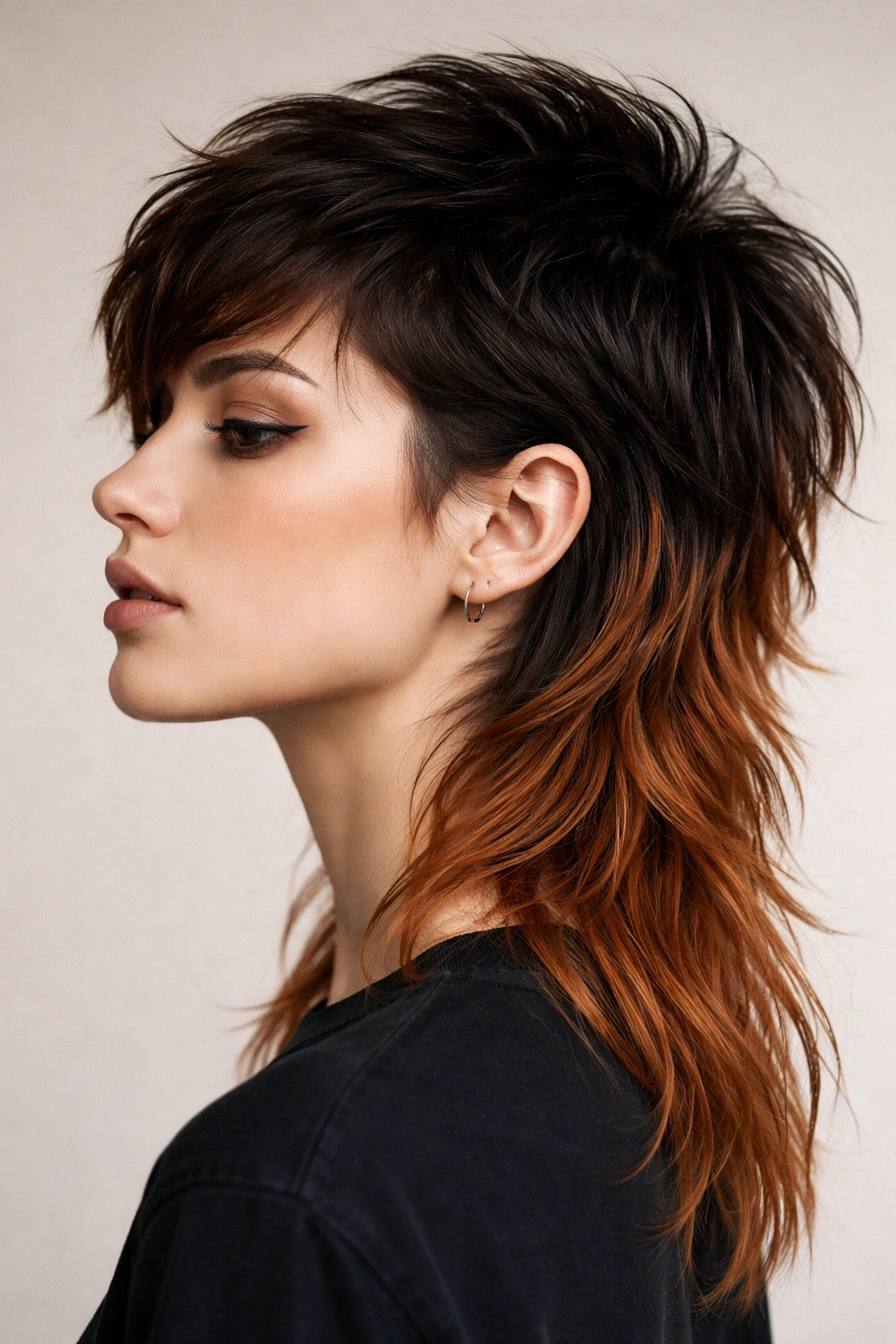 15 Short Mullet Haircuts Worth The Big Chop 14 Close-up profile of a dyed mullet with darker roots and copper back