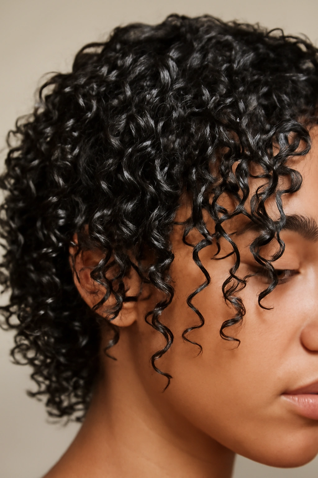 15 Beautiful Ways to Wear Your Naturally Curly Hair 3 Close-up of damp gel-coated curls with defined and separated strands
