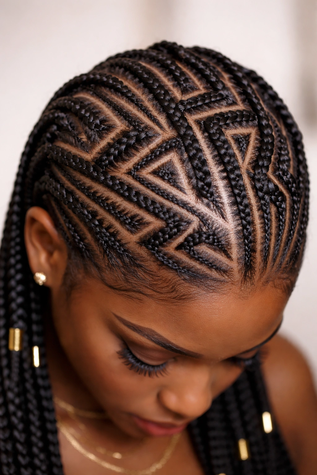 Close-up of geometric cornrows with zigzag patterns on the scalp
