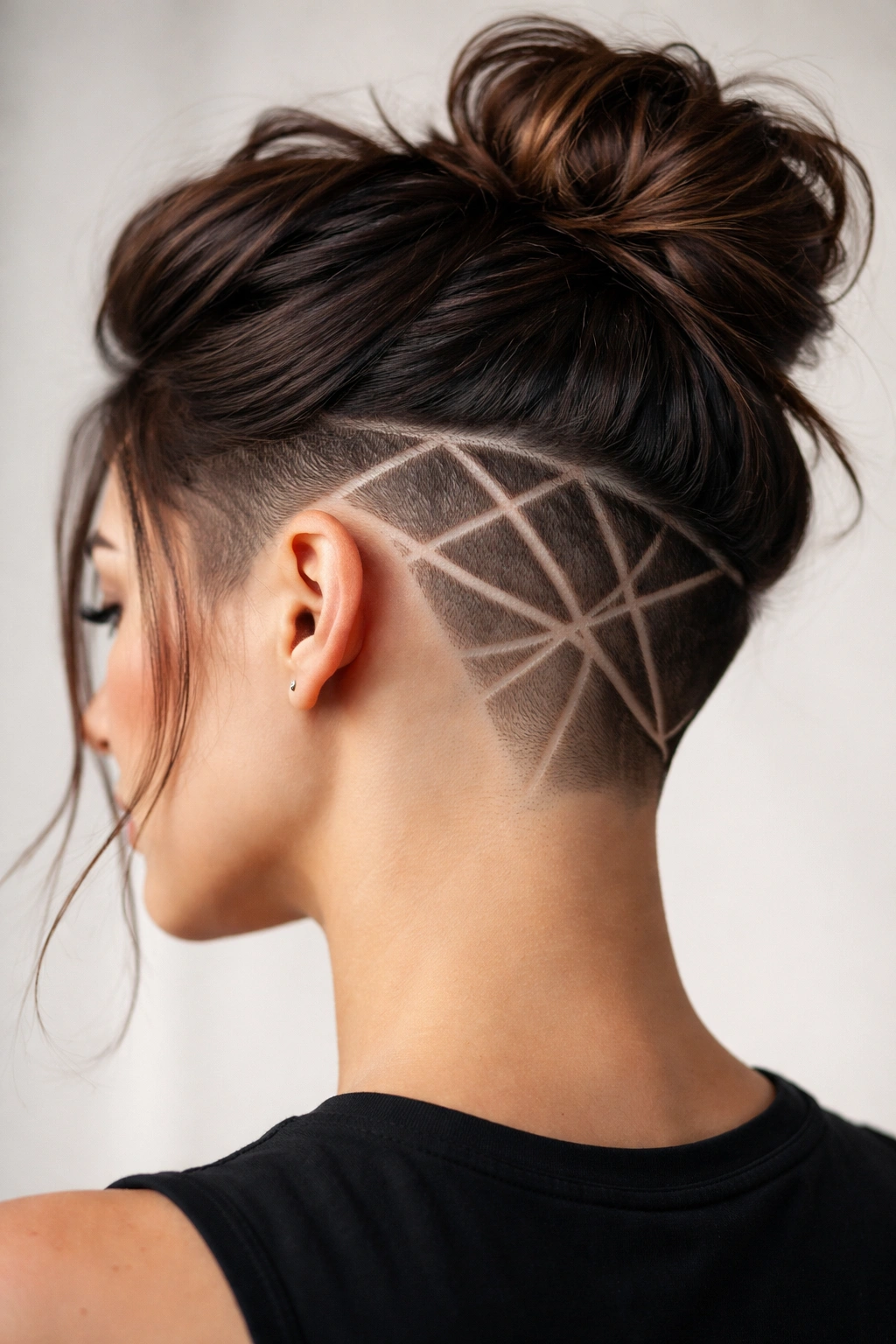 Undercut with shaved geometric patterns visible on the side.