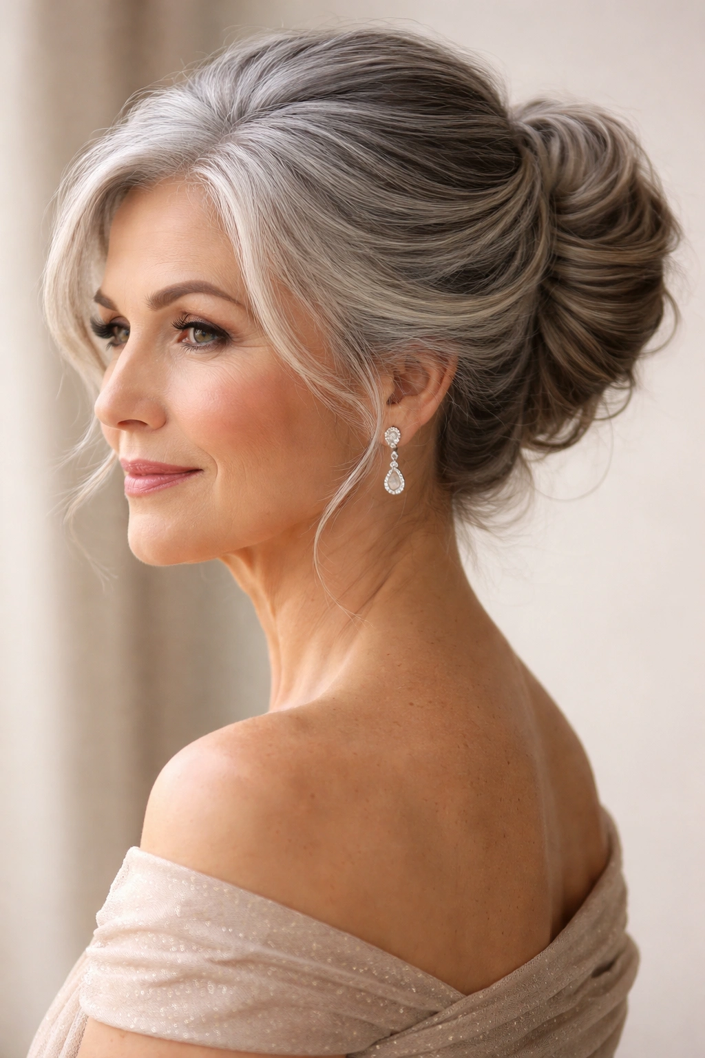 Elegant gray updo hairstyle with soft twists and bun