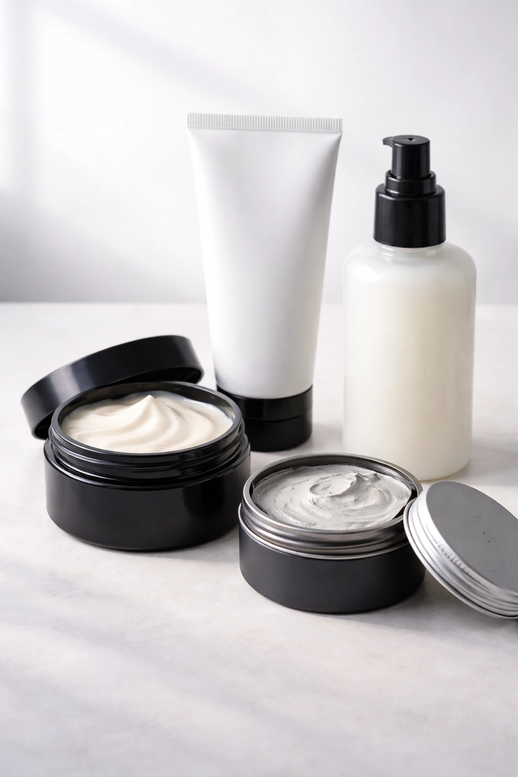 Unlabeled styling products arranged for waves and moisture