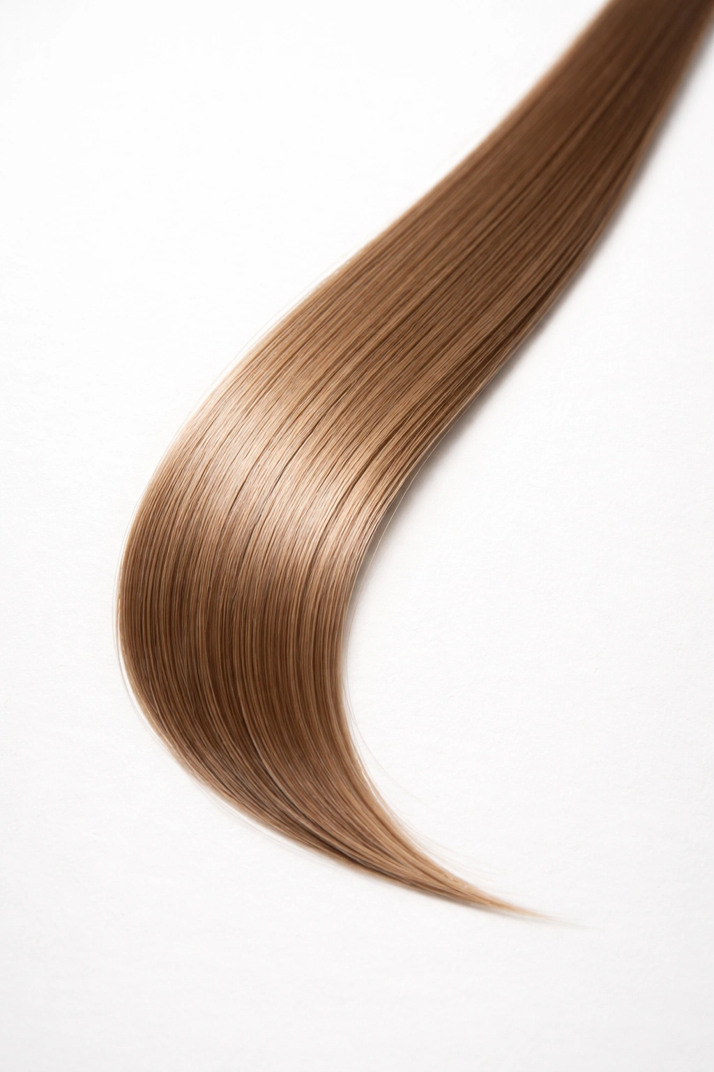 Close-up of a straight hair strand on a plain surface showing safe styling frequency
