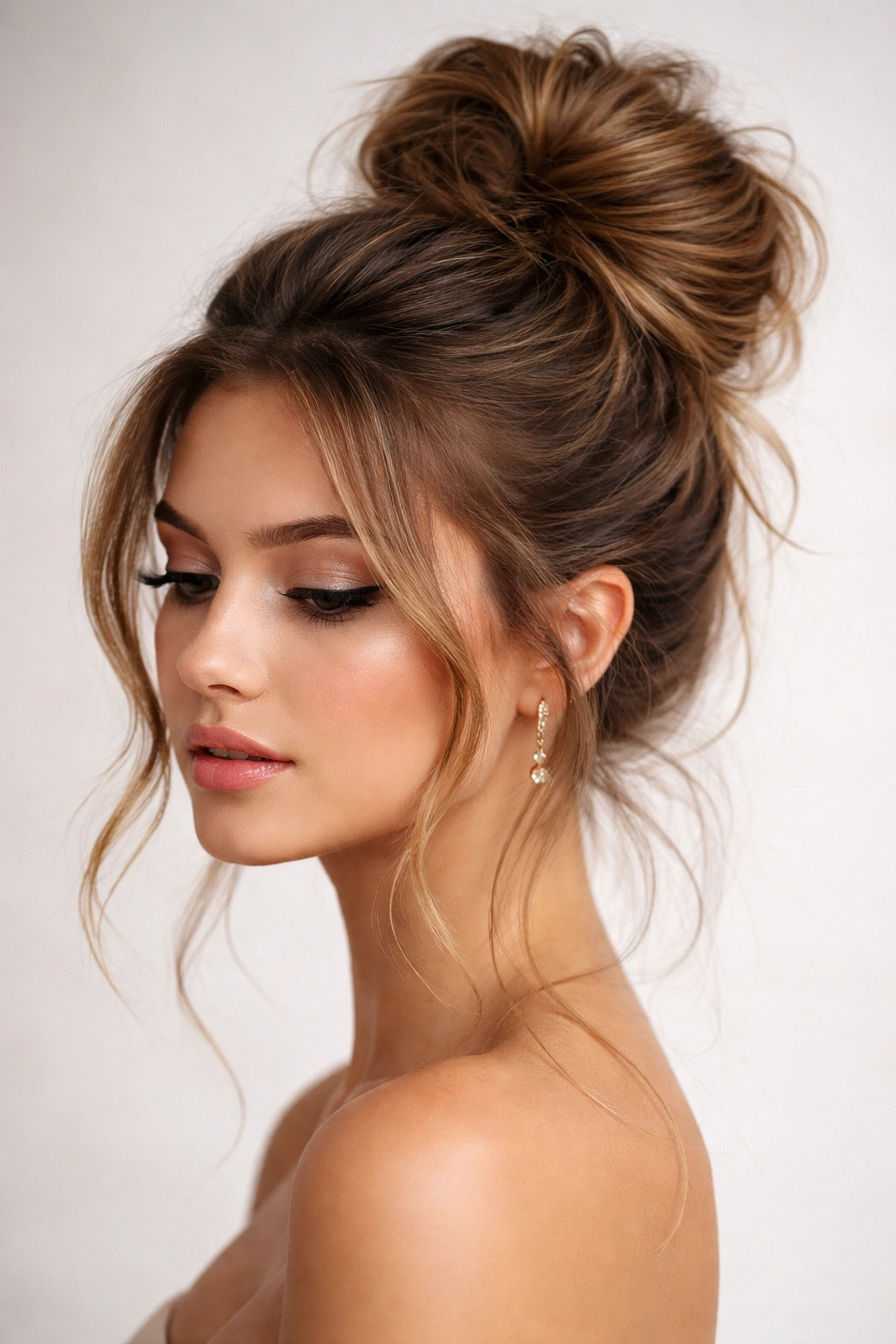 Close-up of high messy bun with loose front strands