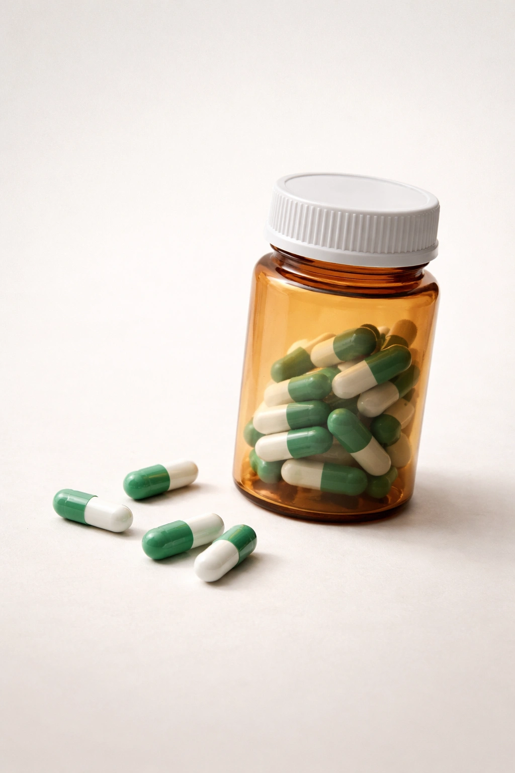 Minimalist pill bottle silhouette with pills suggesting long-term antibiotic use.
