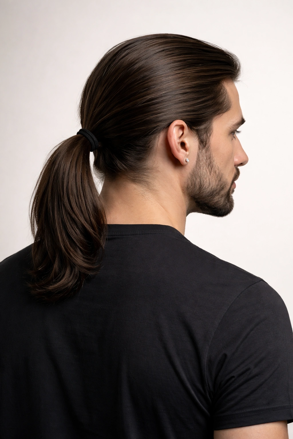 Back view of a man with a classic low ponytail at the nape