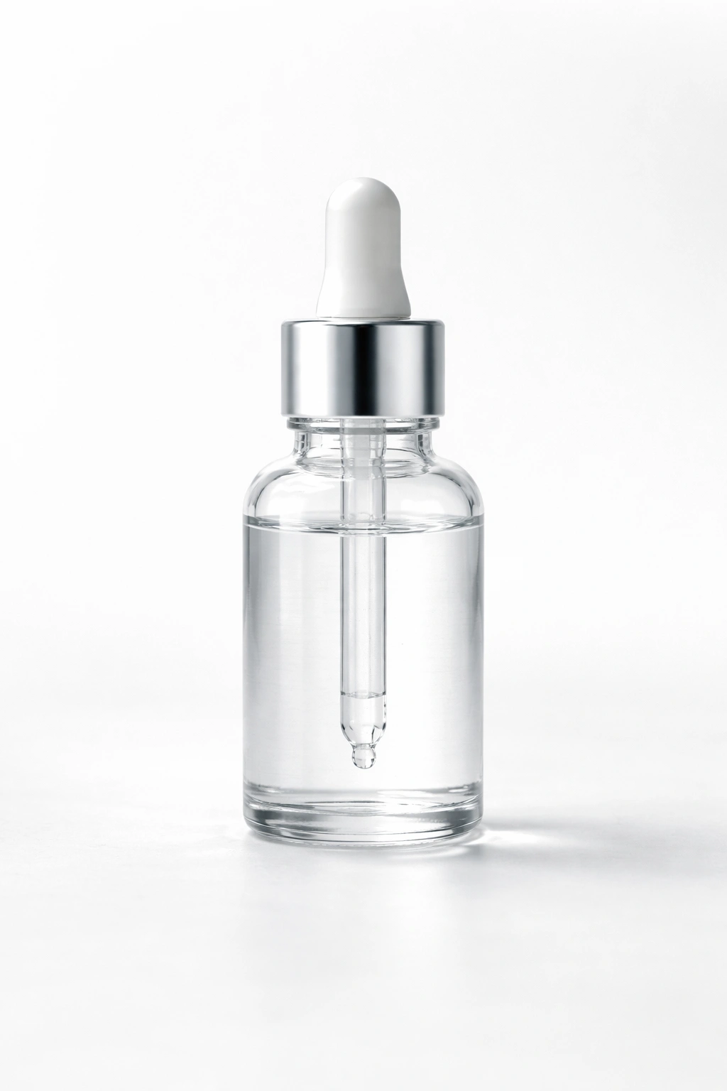 Dropper bottle with colorless liquid representing minoxidil treatment
