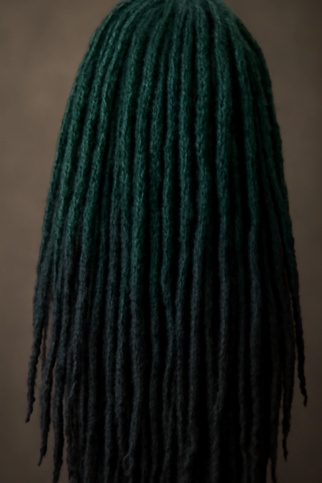 18 Dreadlock Styles Sorted From Short to Long 16 Close-up of ombre colored locs with a vivid gradient