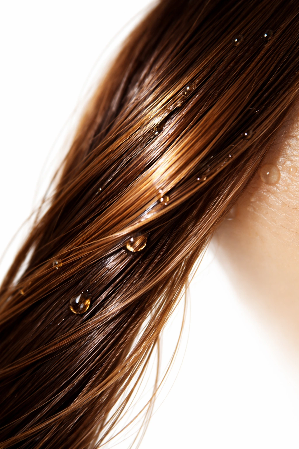Hair strand with natural oils sheen before coloring