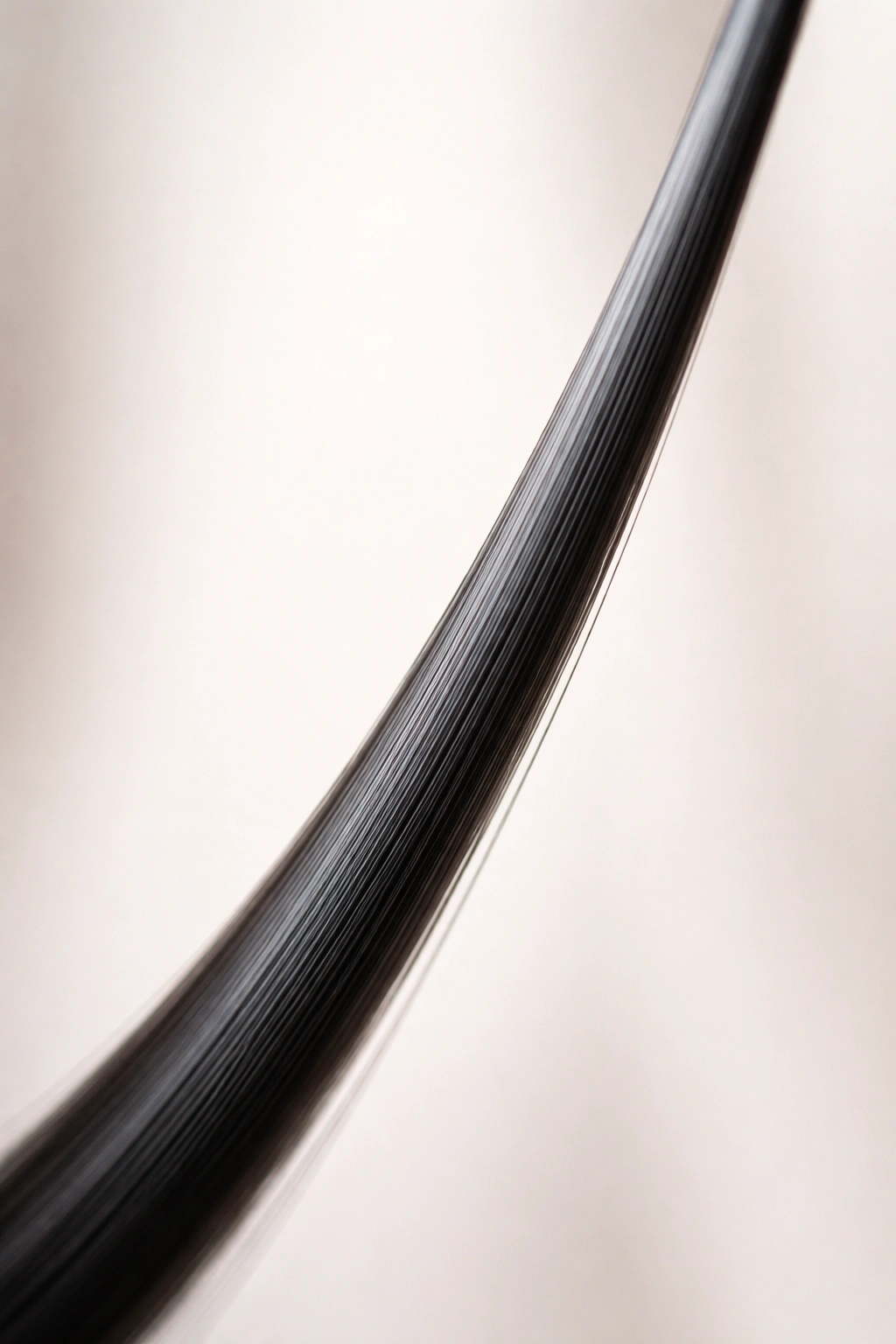 Ultra-straight hair strand highlighting rare Type 1A hair