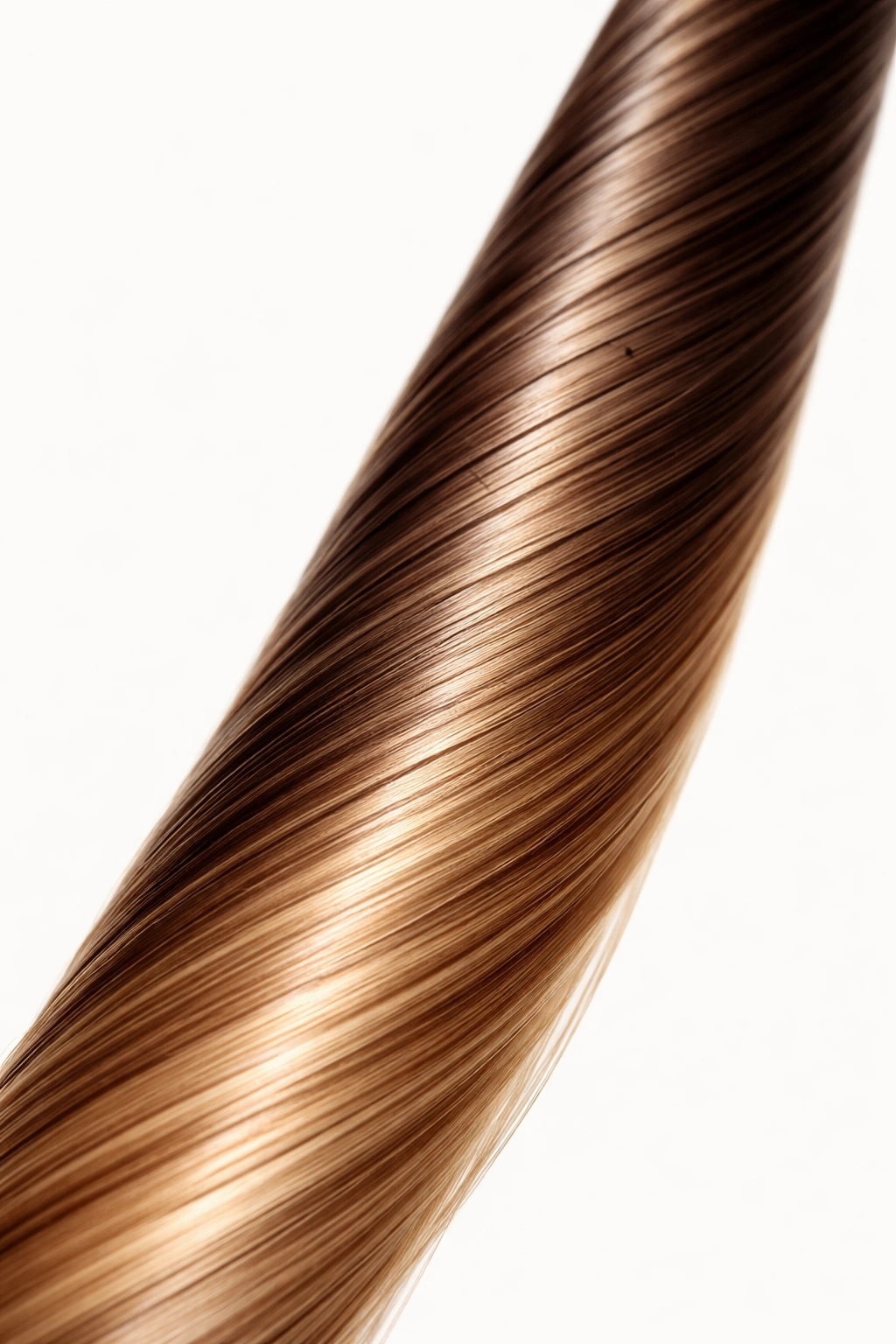 Remy hair strand with perfectly aligned cuticles on plain background
