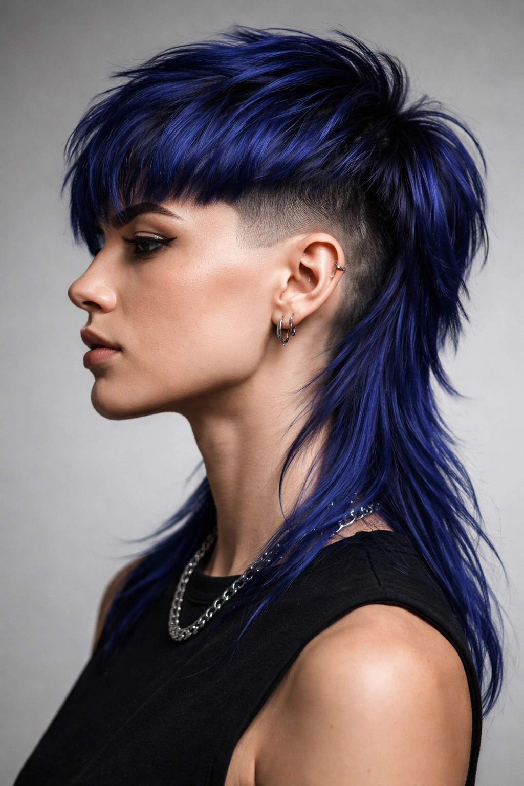 Close-up of sapphire blue undercut mullet with sharp side fade