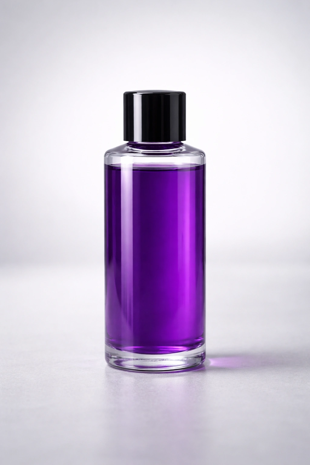 Close-up of a purple semi-permanent dye bottle on a neutral surface