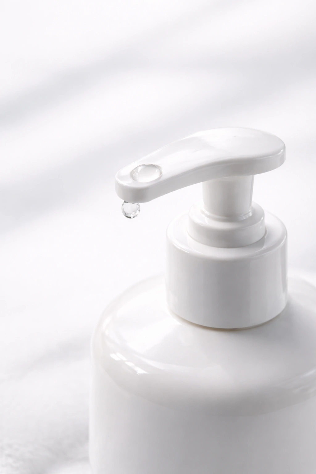 Shampoo bottle with tiny bead at pump