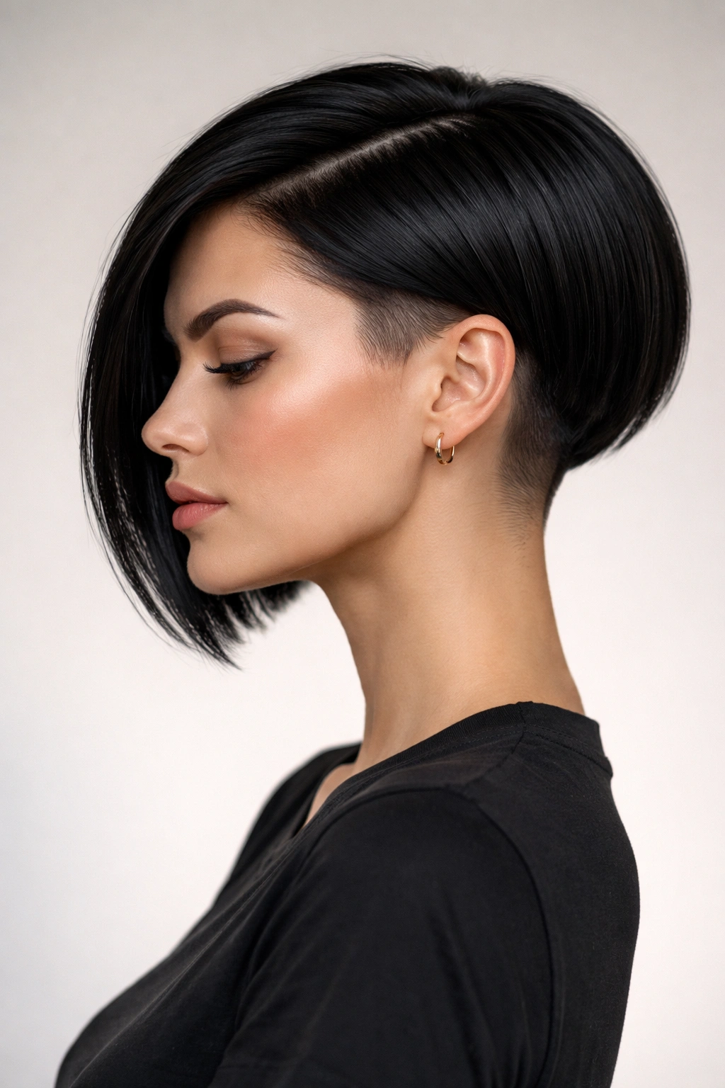 15 Short Haircuts That Work Best On Straight Hair 9 Head-and-shoulders portrait of a straight-haired sleek undercut bob with short sides