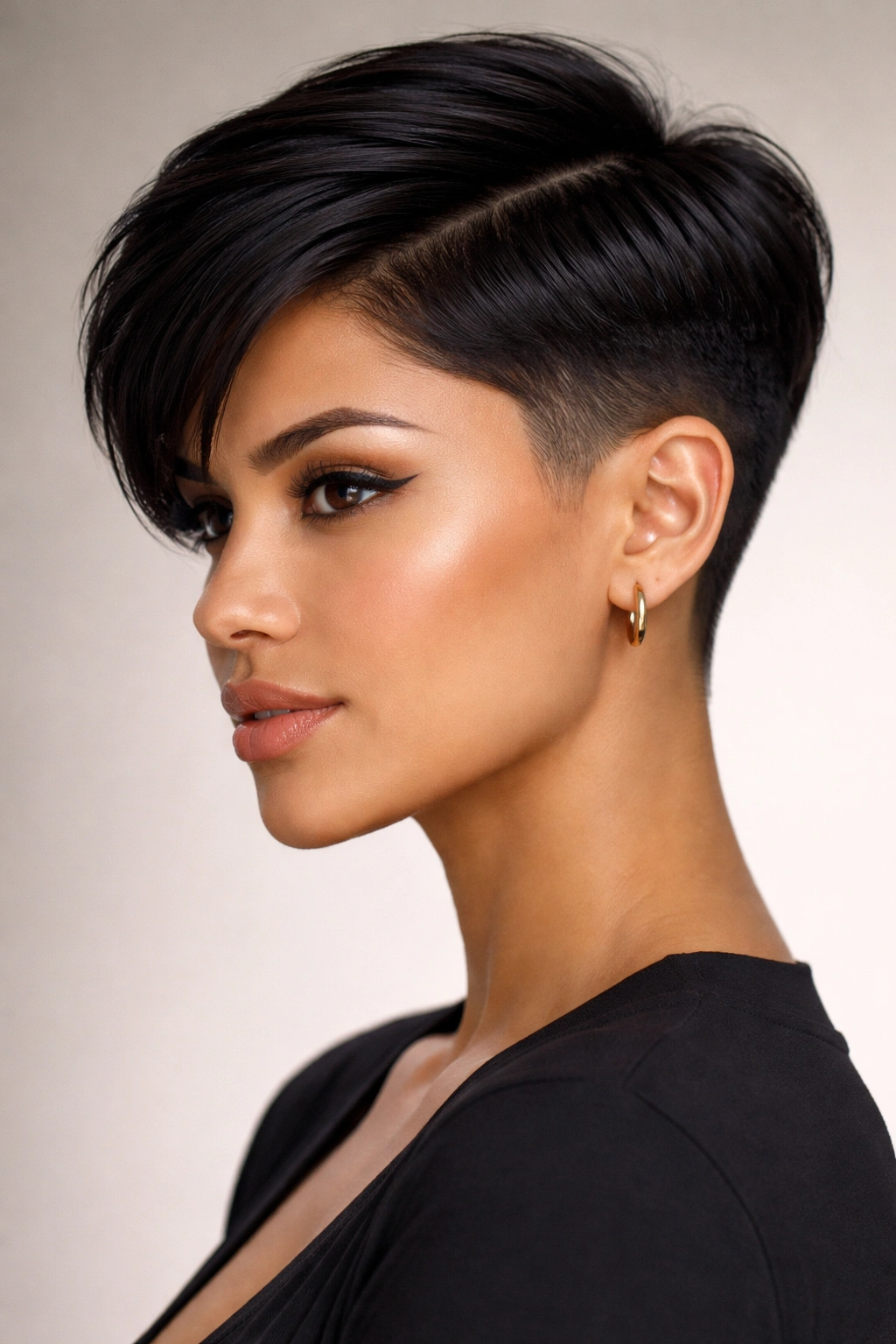 Latina woman with a sleek undercut pixie and clean lines