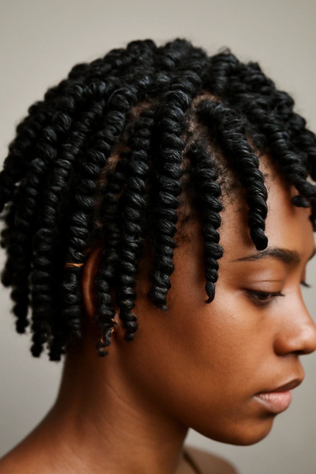 10 Twist Out Styles for Short Natural Hair to Copy 1 Close-up of defined spiral twist outs on short natural hair with corkscrew coils