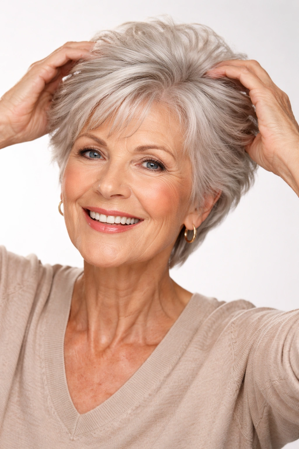 Senior woman styling short hair to add lift and volume.