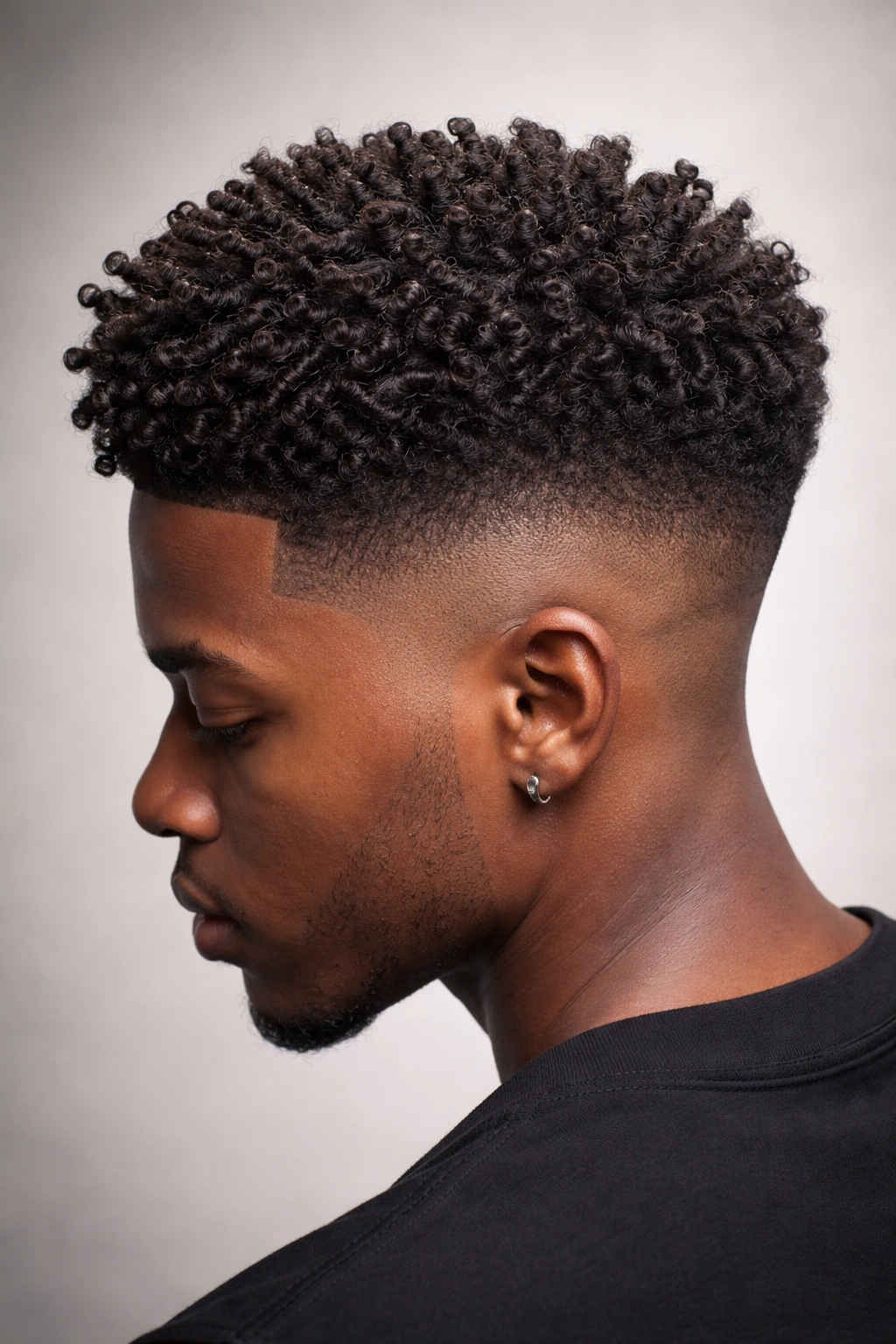 Close-up of a fade with textured crown showing coils and twists
