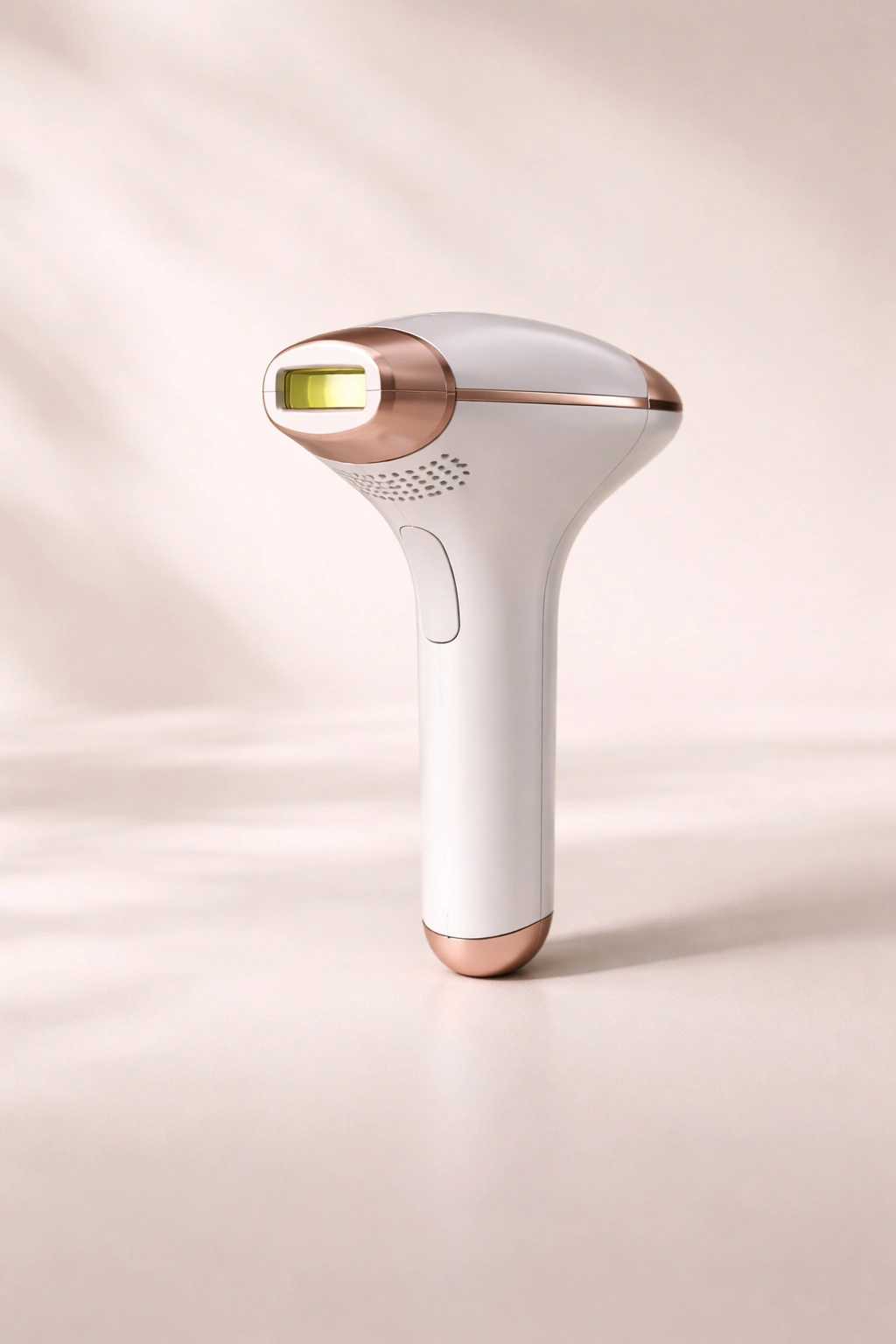 Minimalist silhouette of handheld treatment device on neutral background