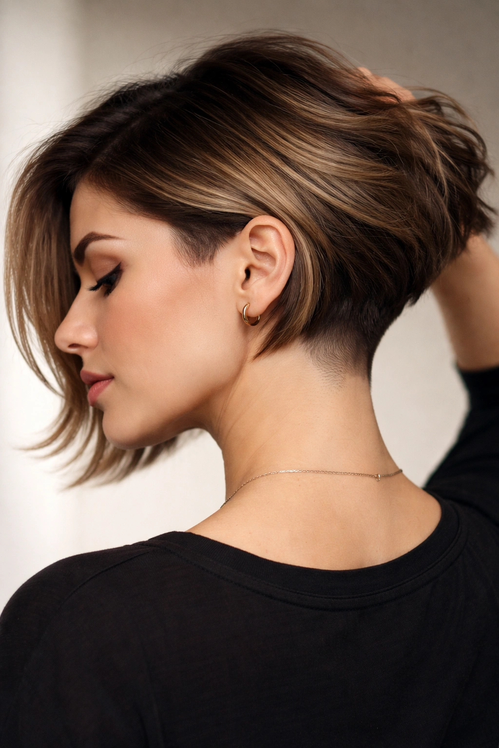Close-up of a person with an Undercut Bob showing the shaved undercut at the nape