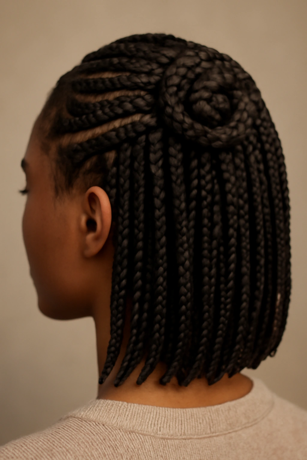 Decorative spiral wrap around a braid at the crown